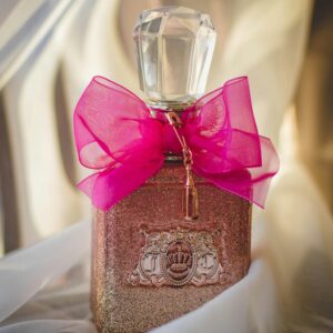 Luxurious perfume bottle adorned with a pink ribbon, capturing elegance and romance.